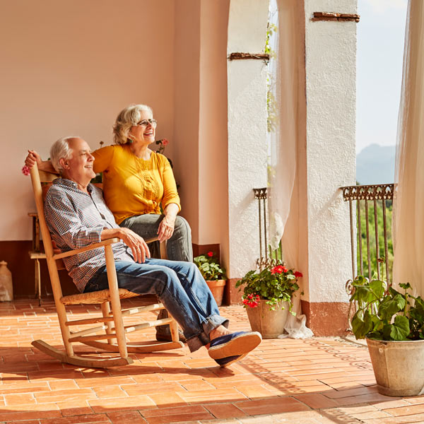 senior couple on patio looking at view